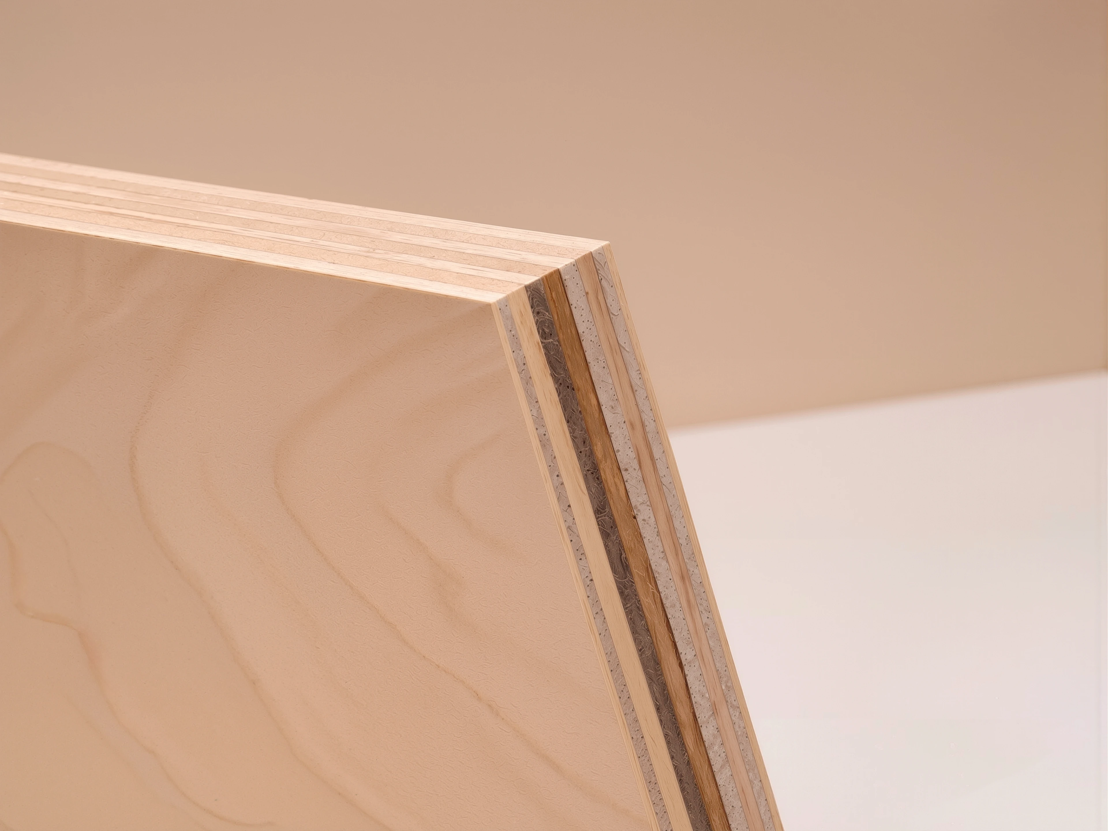 Close-up of the layered wood-grain edge of a MUUJEE album cover.