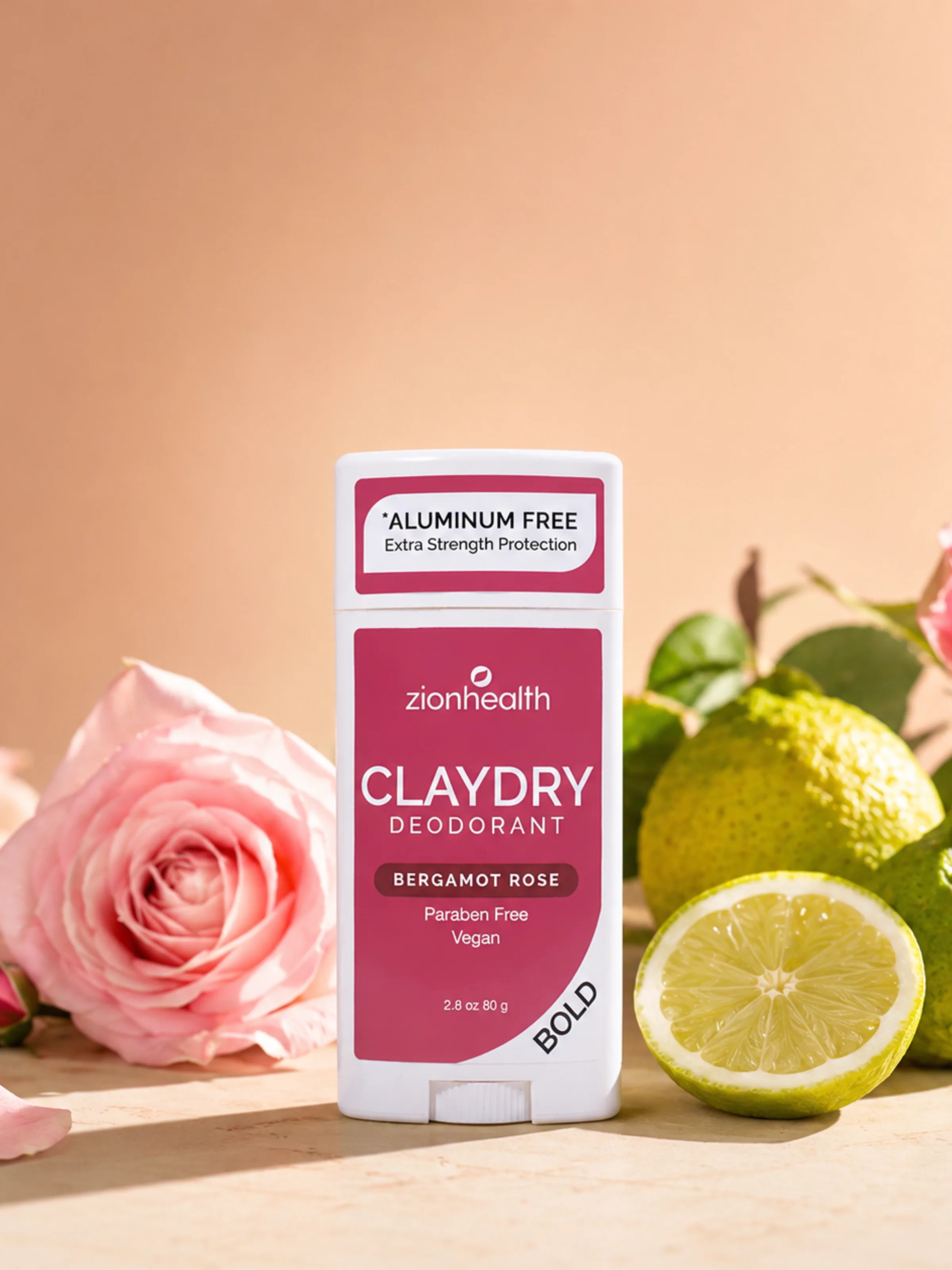 Zion Health Claydry Deodorant Bergamot Rose styled with a pink rose and citrus.