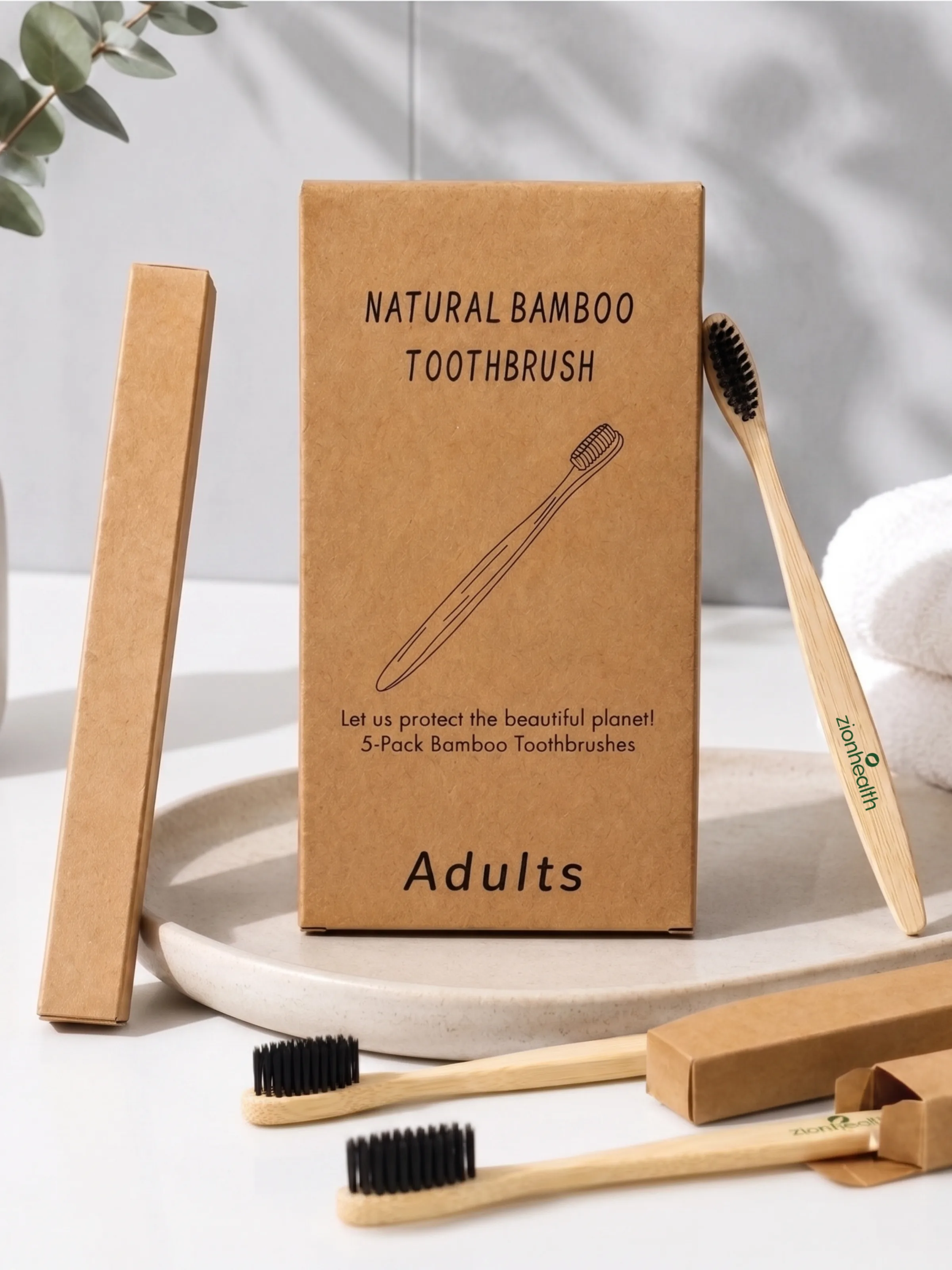 Zion Health Natural Bamboo Toothbrush five-pack packaging with toothbrushes, eucalyptus, and towels.