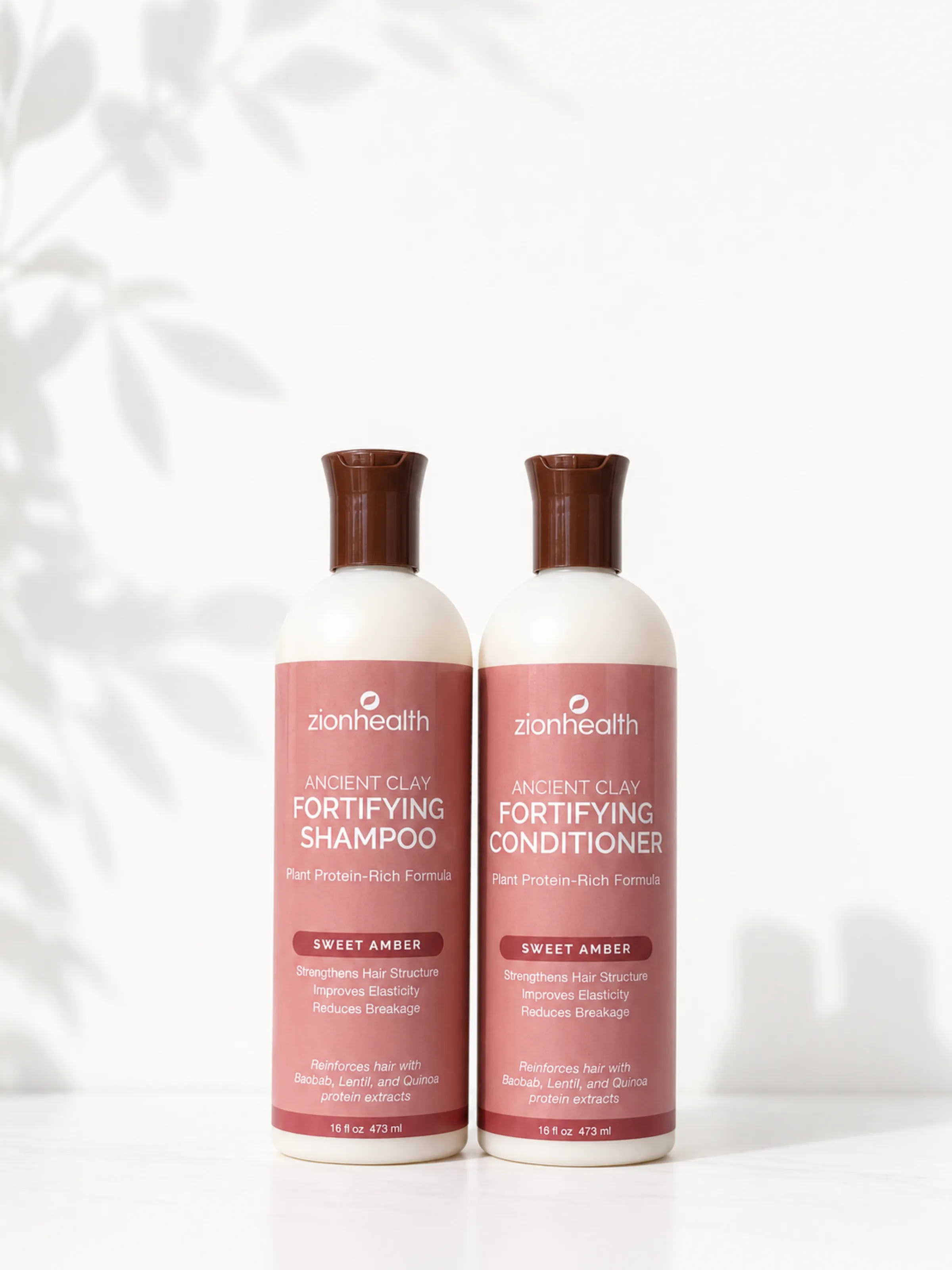 Zion Health Ancient Clay Fortifying Shampoo and Conditioner in Sweet Amber, a plant protein-rich formula.
